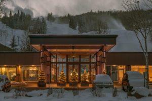  luxury aspen lodging with snow behind lodge