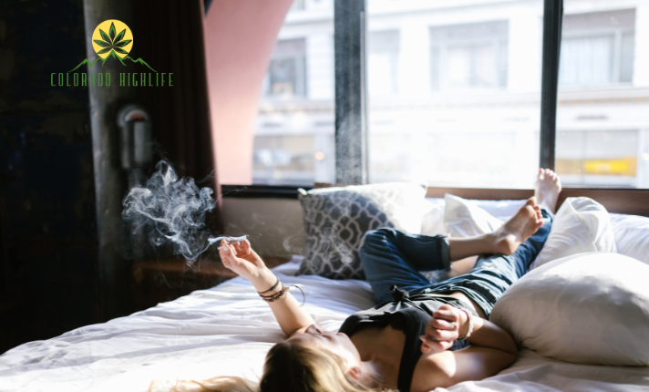 woman smoking cannabis in a hotel room