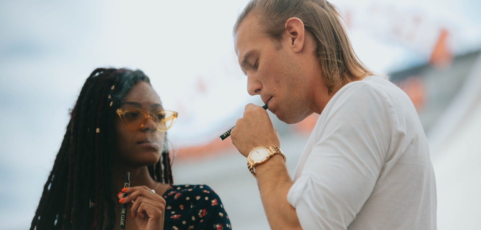 two people vaping cannabis oil